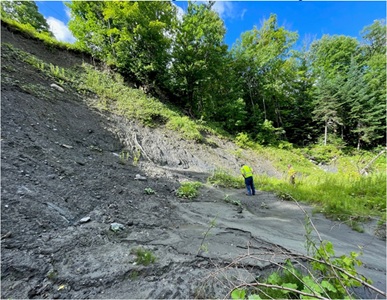 Road foreman checking slide eroding Bruce Badger Memorial Highway